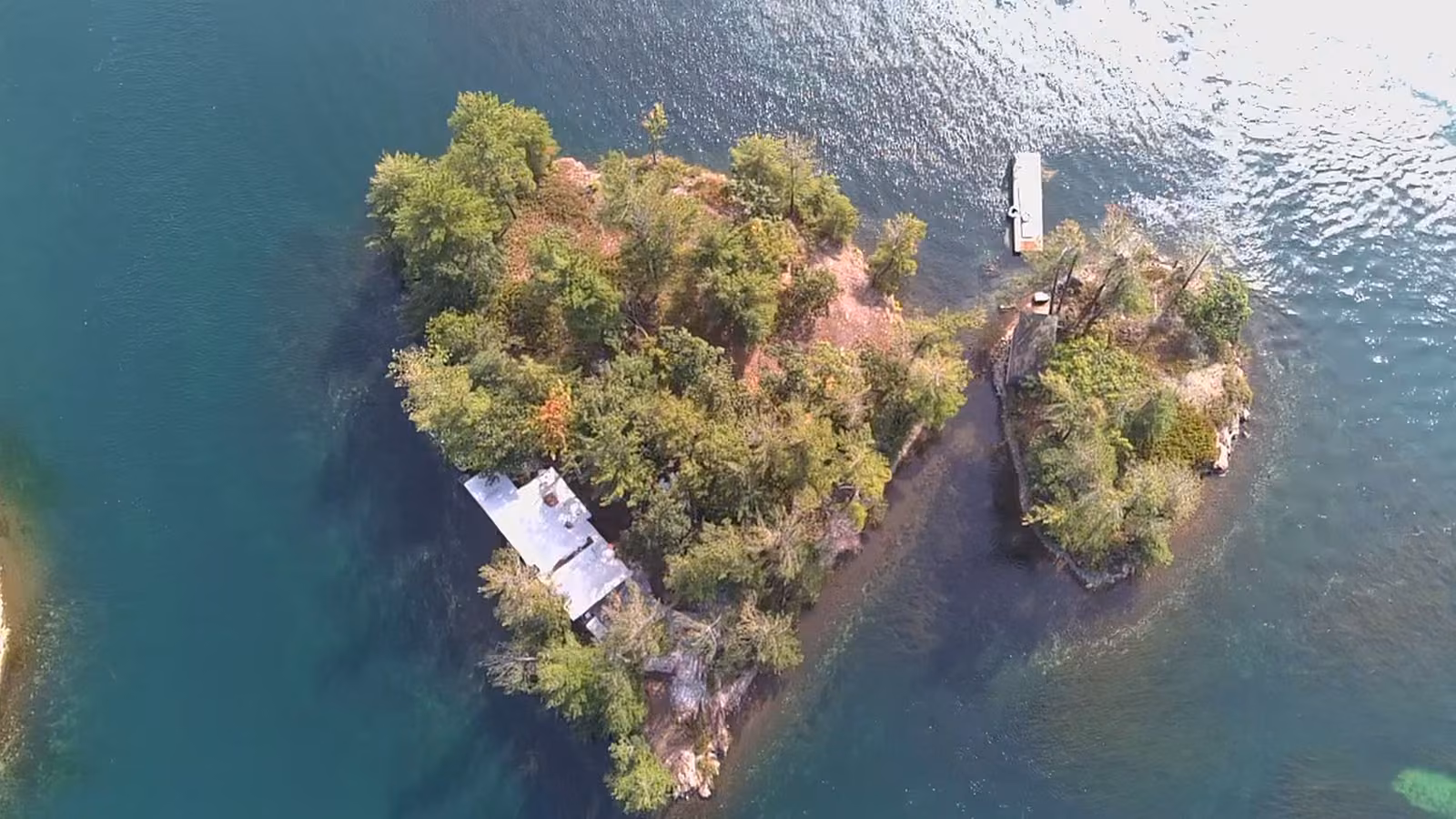 Aerial view of a small private island surrounded by the St. Lawrence River