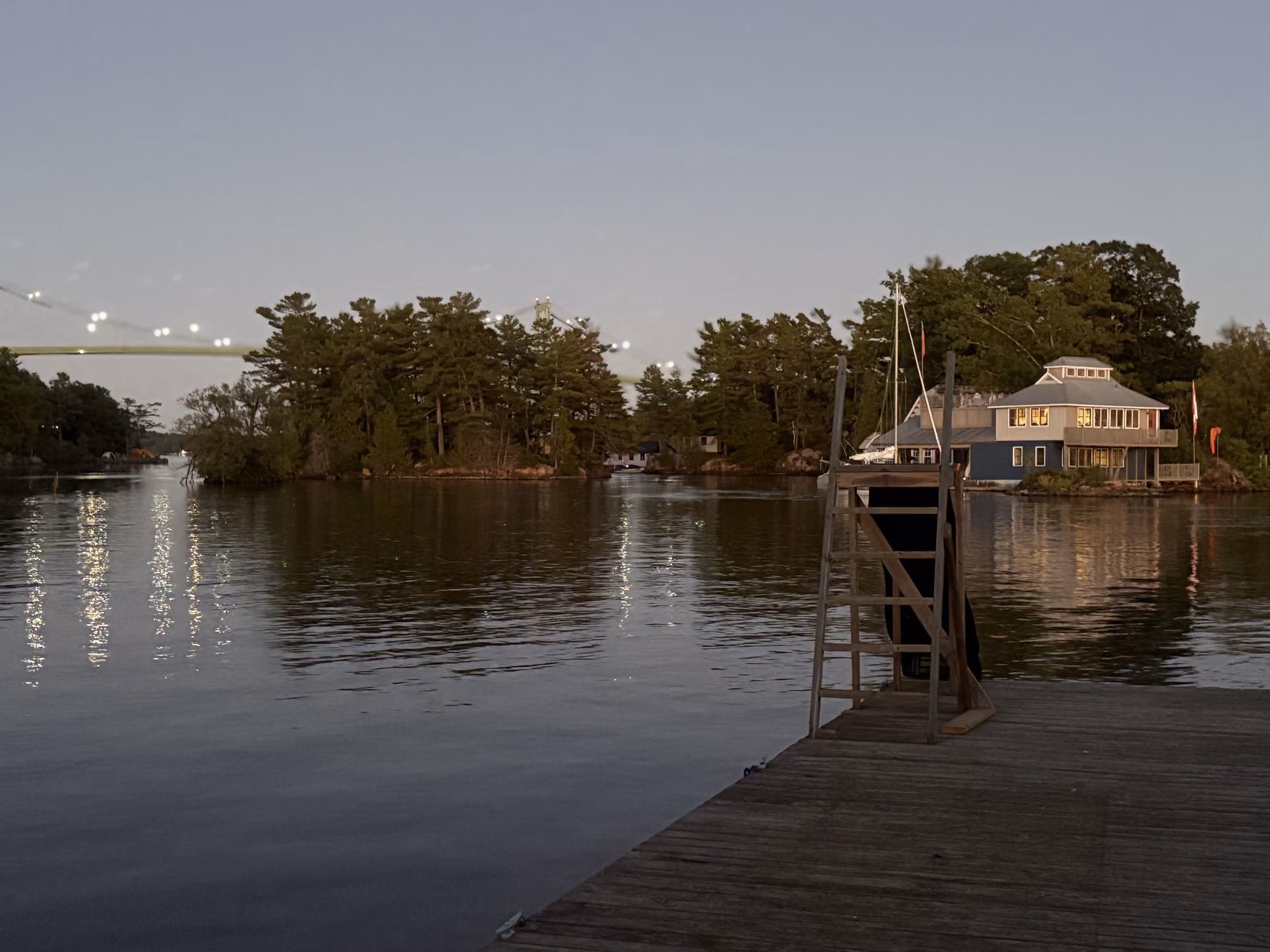 The private dock reaching into the channel at dusk